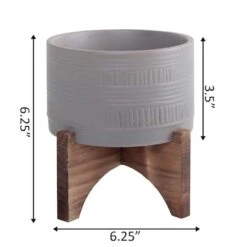 Flora Bunda 5" Matte Gray Pueblo Pot Planter With Wood Stand 6 Flora Bunda 5" Matte Gray Pueblo Pot Planter With Wood Stand -Michaels Shop D600004S 2